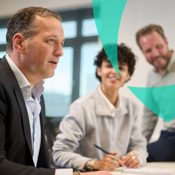 Team of professionals discussing strategies during a meeting in a modern office.