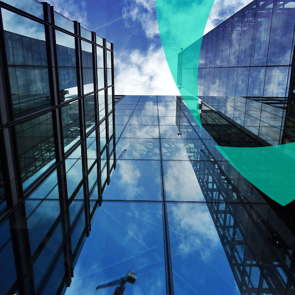 Modern corporate buildings reflecting risk management for self-insured and captive insurance programs.