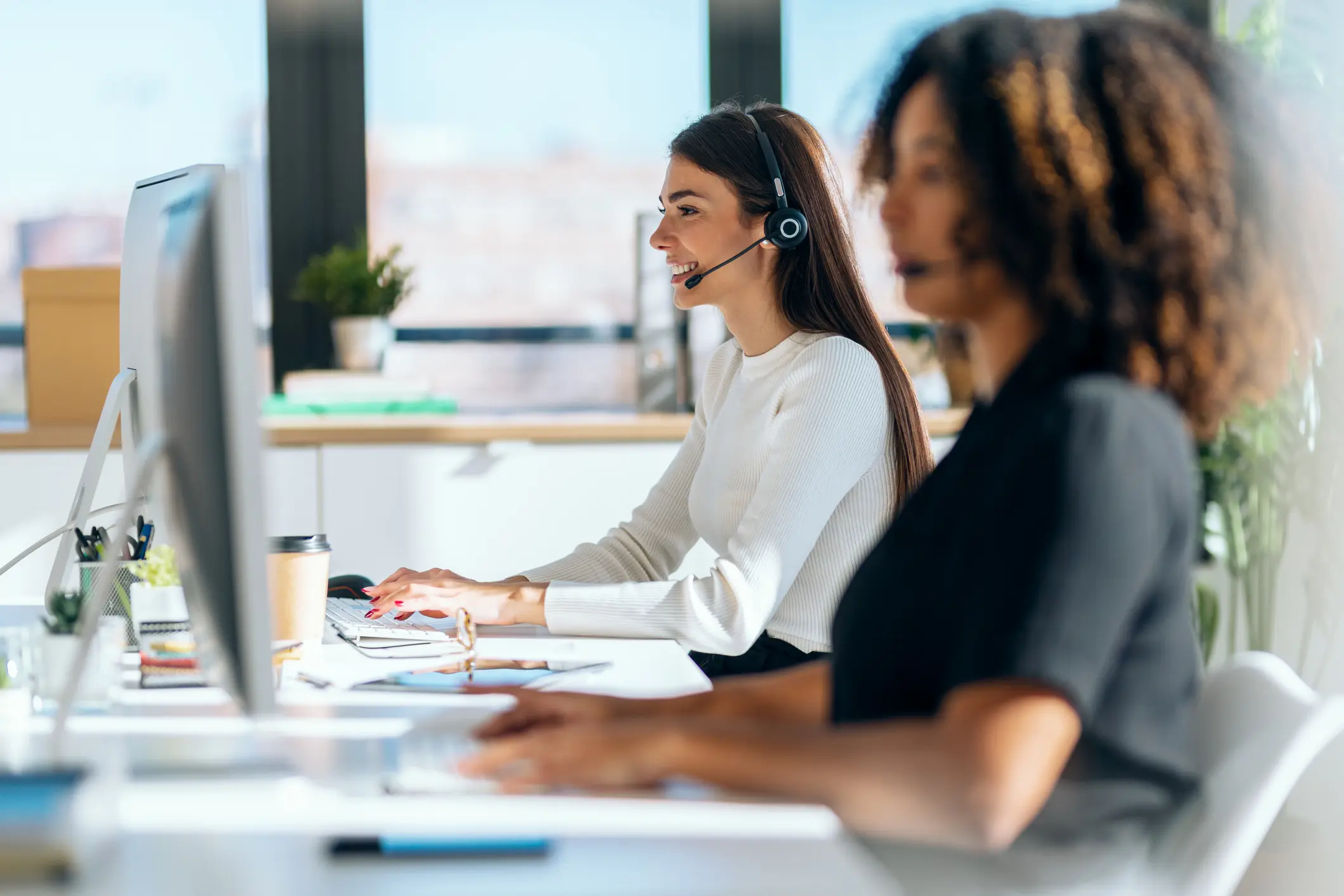 Van Ameyde claims handlers supporting client inquiries and cases in a professional office setting.